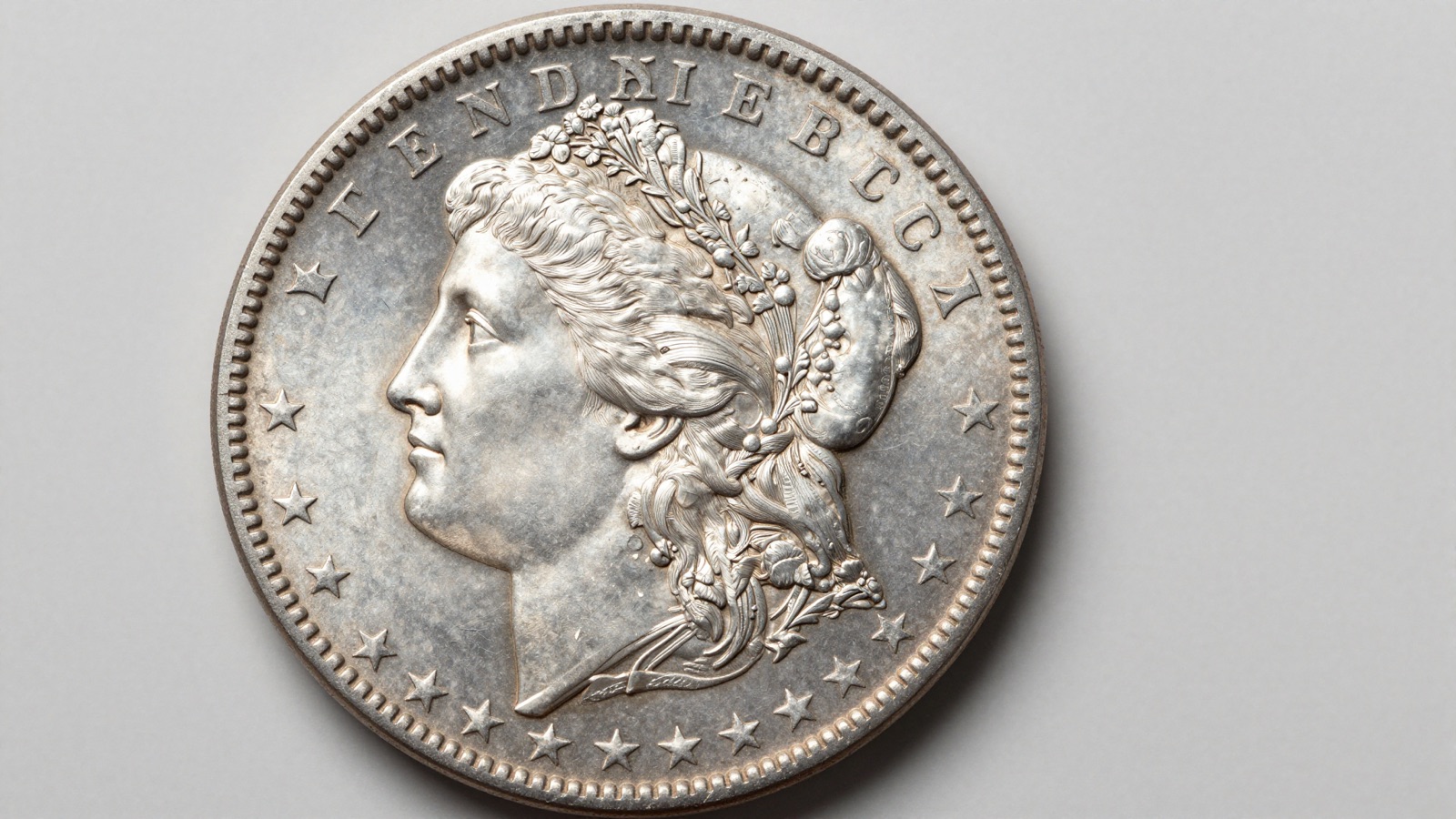 Uncirculated Morgan silver dollar showpiece displaying Liberty obverse with sharp detail and frosty cartwheel luster
