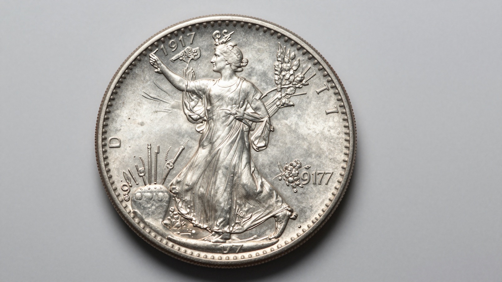 Sharp uncirculated Walking Liberty silver half dollar showing full obverse detail on neutral studio surface