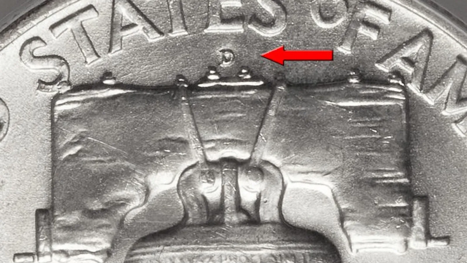 Close-up of the small D mint mark above the Liberty Bell on the reverse of a Franklin half dollar